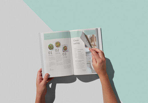 Woman Hands Turning Pages of a Hardcover Book Mockup