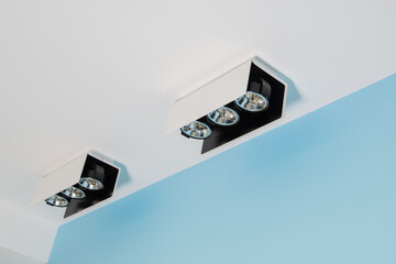 Lighting devices in the clinic, bright professional lamps in the doctor's office. Bright triple...
