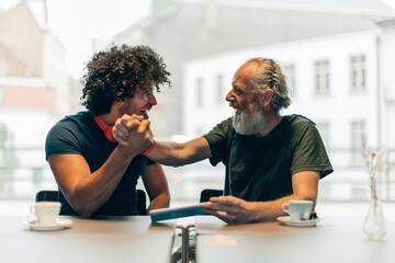 two friends congratulating them self for a good news