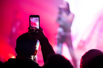 Video and photo recording of the Color music concert by smartphone. Beach party.