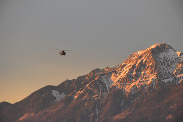 Helicopter fliying over mount Storzic in Slovenia © Martin