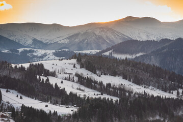 Carpathian mountain village covered by fresh january snow. Winter landscape. Ukraine, Europe
