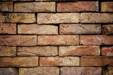 Brick wall build of rustic bricks.