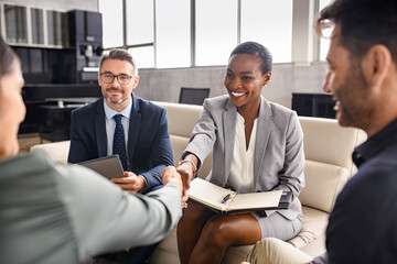 Business people shaking hands during meeting