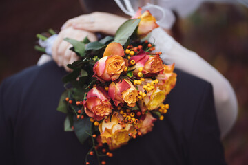 Wedding couple holding flowers