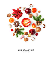 Christmas cookies, fruits, candle, nuts poinsettia and fir tree branch