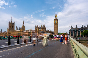 Long exposure of the Houses of Parliament in London with blue sky seen from Westminster Bridge with...
