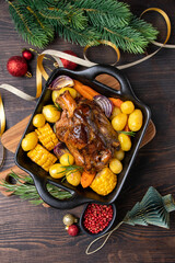  festive food with Christmas New Year Pork shank knuckle with baked potatoes and corn - obrazy, fototapety, plakaty