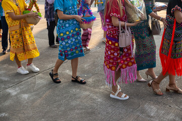 Fototapeta na wymiar group of tribal women are walking to charity..
