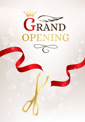 Grand opening banner with cut red ribbon and gold scissors.