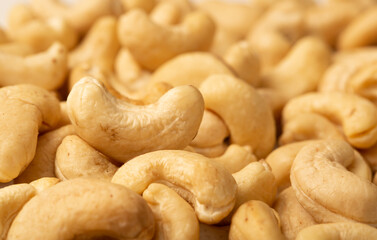 Cashew nuts as a background, top view. Cashew isolated on white background. Healthy foods.