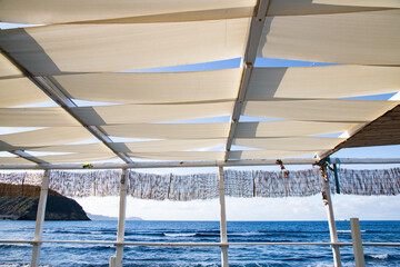 white  empty beach huts in Procida