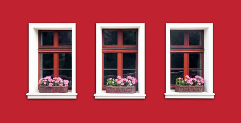 Windows with flower box. Italian architecture background. Vibrant color red wall facade. Small town house exterior. Street of European city building. Three window frames isolated on empty wall.