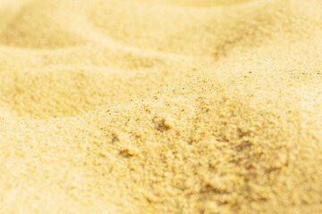 Close-up of sand on the beach. Toned photo with low depth of field. Small grains of sand on a clean beach.
