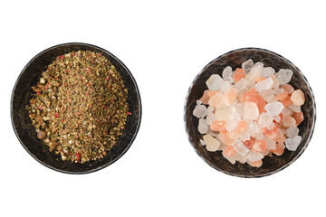 Overhead view of saucers with pepper and himalayan salt