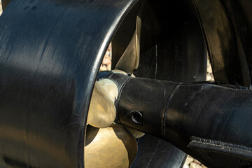 Close-up of the back of a miniature submarine. Submarine propeller with protective ring.