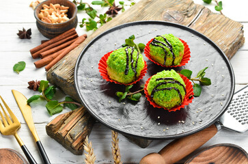 Dessert. Chocolate green cakes with coconut. Sweets. Top view. Rustic style.