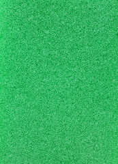 Fototapeta premium close-up green dishwashing sponge background