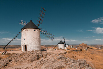 View of medieval Castle of Consuegra and Don Quixote windmills in Toledo, Spain