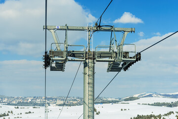 Overhead cable car gondola pylon in winter at Zlatibor mountain