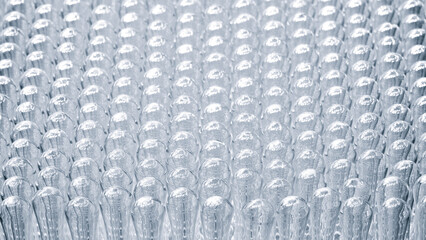 Pharmaceutical industry. Production line machine conveyor with glass bottles ampoules at factory. Pharmaceutical industry concept background.