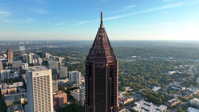Aerial orbit reveals downtown Atlanta skyline. Bank of America Tower featured.