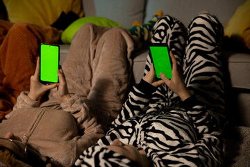 Fototapeta premium Girls having fun on slumber party together