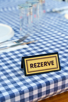 Reserve table dinner. A plate for reserving a table in a restaurant for an evening dinner