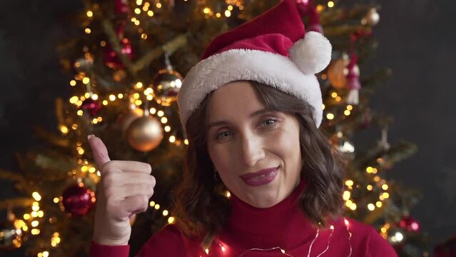 woman calls her friends via video conference call wishing Merry Christmas