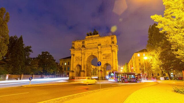 Sunset hyperlapse at The Siegestor Victory Arch in Munich City Bavaria with traffic. Day to night timelapse in 4K