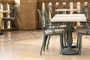 Chairs and tables in the outdoor cafe. Chairs on the terrace.