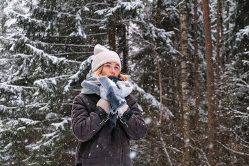 Fototapeta na wymiar Winter.woman walks through winter snowy forest. Mental and physical health. Unity with nature.travel outdoors, hiking, spending time outdoors,winter travel,slow life,christmas forest.