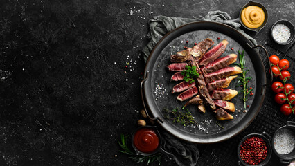 Chopped juicy porterhouse steak or T Bone Steak dry aged of beef Ready to Cook on wooden Board with...