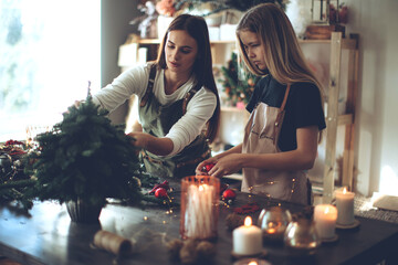 A woman makes a Christmas tree with her own hands. High quality photo