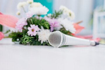 microphone and flowers on the wedding table