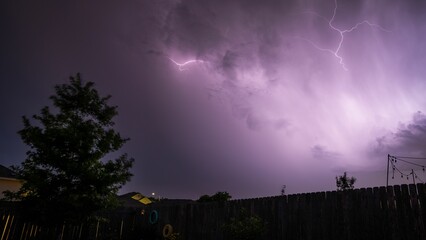 Dramatic shot of lightning in a dark purple night sky