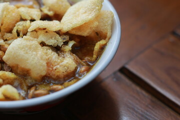 a close up of a ready-to-serve bowl of chicken porridge
