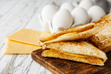 delicious cheese sandwich on a white rustic wooden background