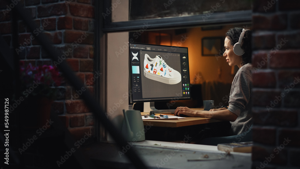 Aufkleber View From Outside The Window in the Apartment: Female Footwear Designer Creating and Rendering 3d Model of Shoe and Working on Desktop Computer. Shoe Production Procedure Concept.
