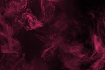 Obraz premium Yellow and pink steam on a black background.