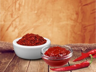 Spicy paste or sauce in bowl with paper