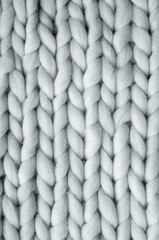 Close up above view of grey soft wool knitted wool background.