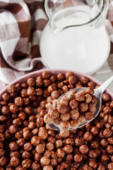 sweet crunchy chocolate children's breakfast chocolate balls on a white background