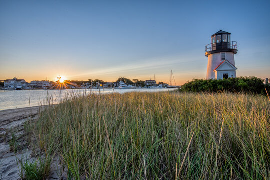 Originally a lamp was hung in the window of a shack to guide mariners around Hyannis Harbor until the Hyannis Harbor Lighthouse was built in 1849.