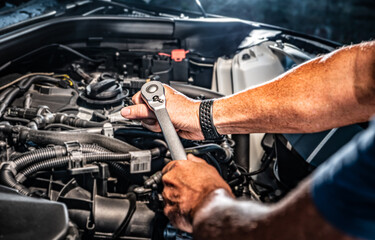 Obraz na płótnie Canvas Auto mechanic working in garage. Repair service.