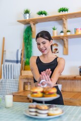 Say no to carbohydrates and junk food. Young asian beautiful female lady in fitness costume say no...