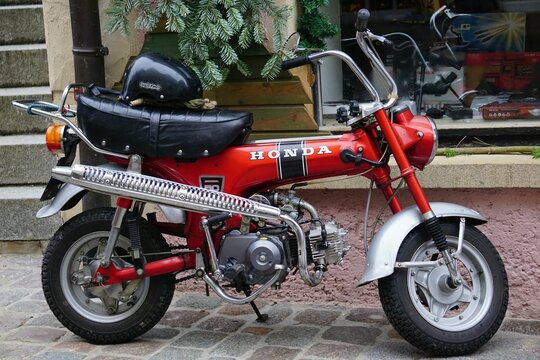 Honda minibike parked on the street of an old town Bad Wimpfen in Germany