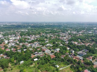 aerial view of residential area filled with greenery.