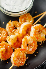 delicious grilled shrimp appetizer on a black wooden rustic background