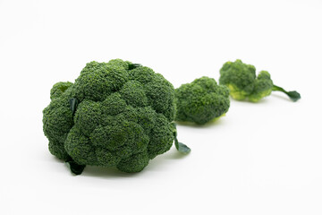 some pieces of Broccoli isolated on white background. Creative layout made of broccoli.fresh Food concept